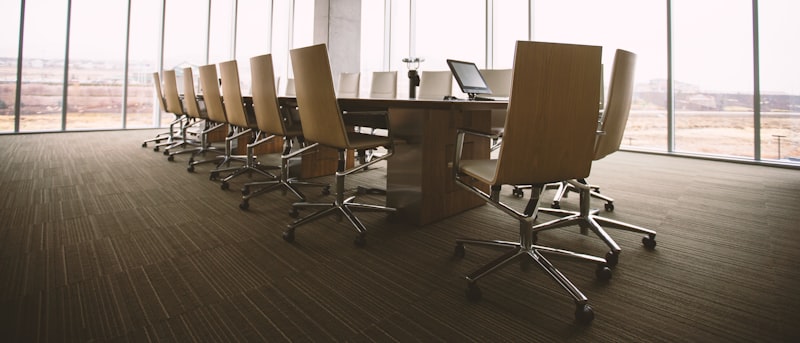 An empty meeting room with morning light across the table
