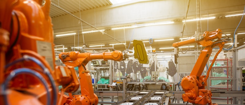 Robotic arms at work on a factory assembly line