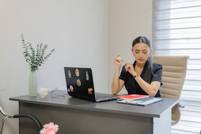 A founder at work at a desk by a window
